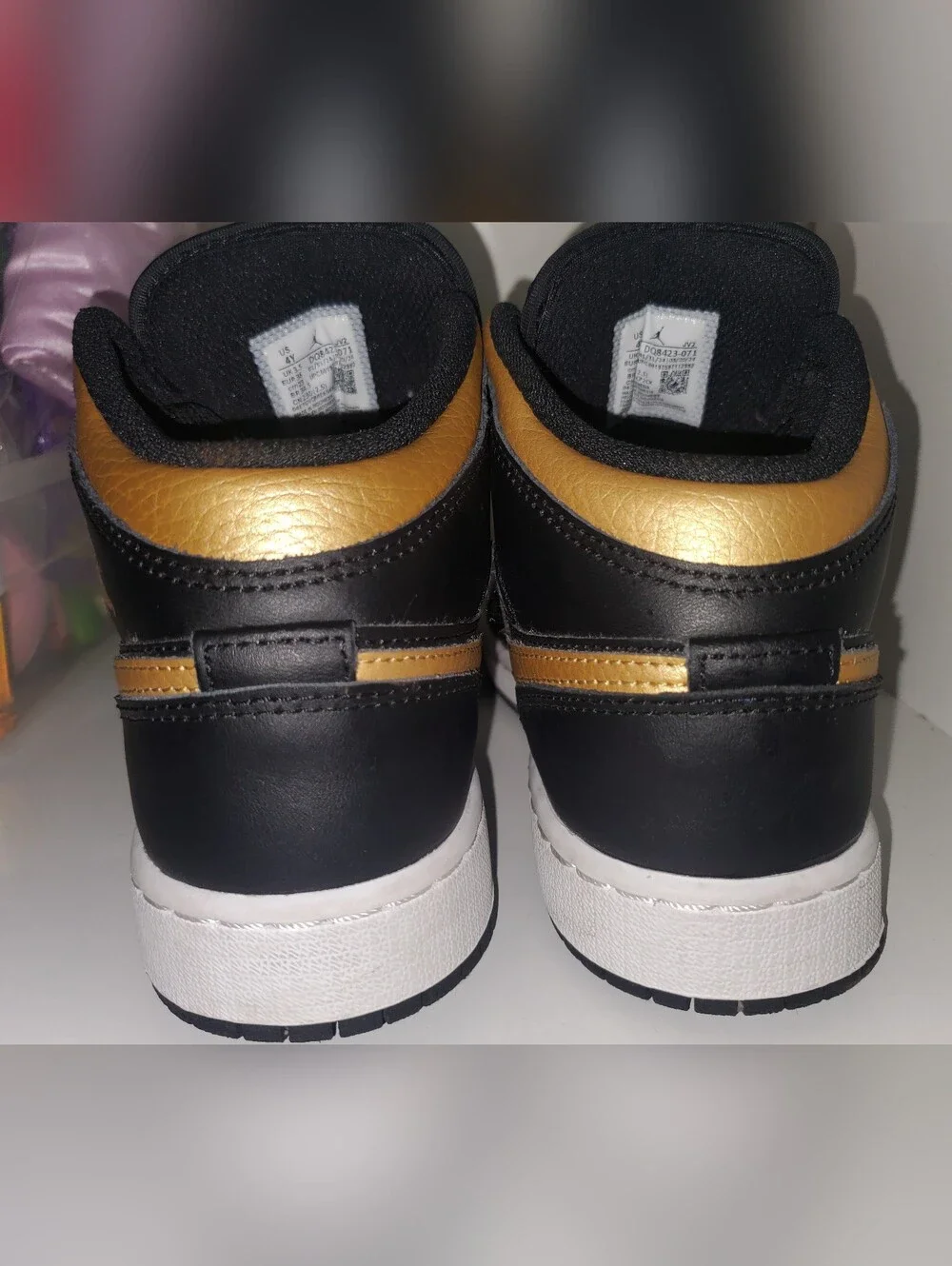 Nike Air Jordan 1 Mid Black/Gold Low-Top Sneakers